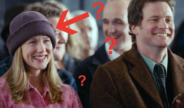 Laura Linney and Colin Firth laughing in a church in a scene from Love Actually.