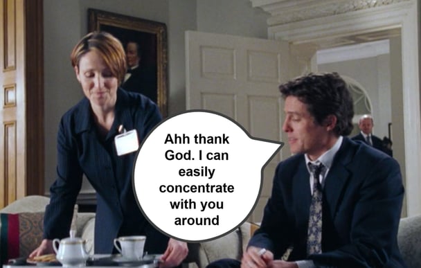 Hugh Grant with a woman serving tea in Love Actually.