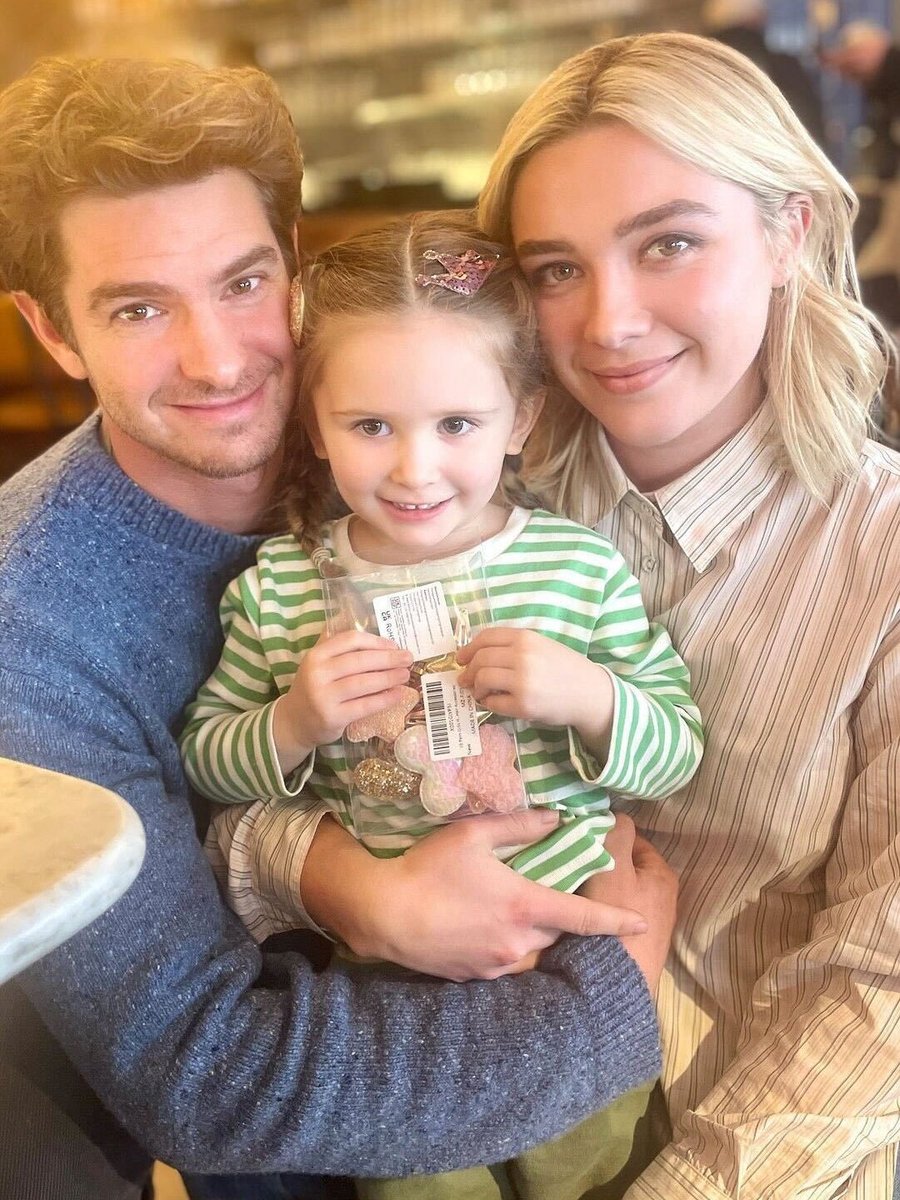 Florence Pugh and Andrew Garfield star in the We Live In Time, with their "child"