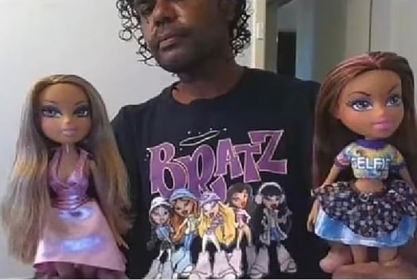 Kelly pictured holding Bratz dolls