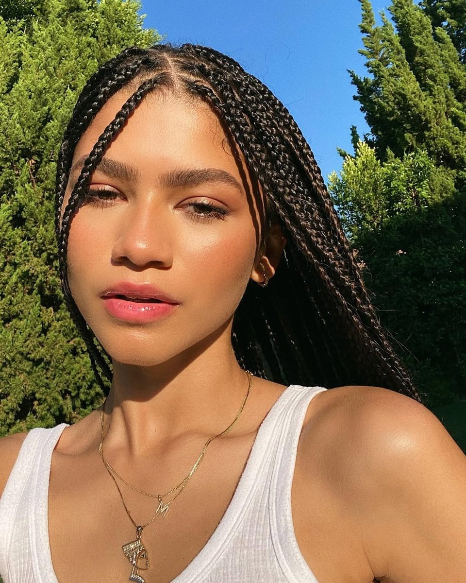 Actress Zendaya poses in selfie on Instagram, with glossy lips and glowing skin.