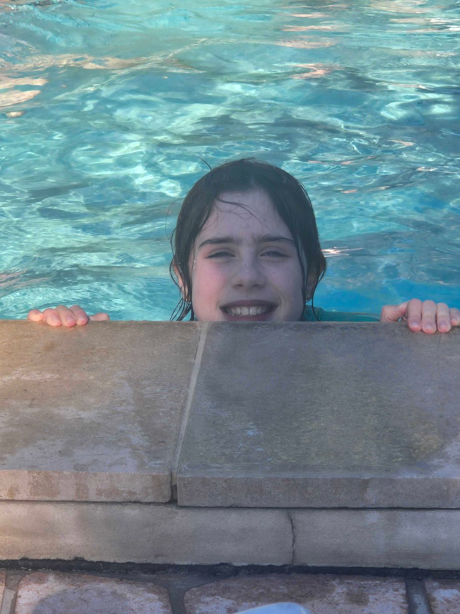 Child enjoying heated swimming pool at Discovery Parks Emerald Beach.
