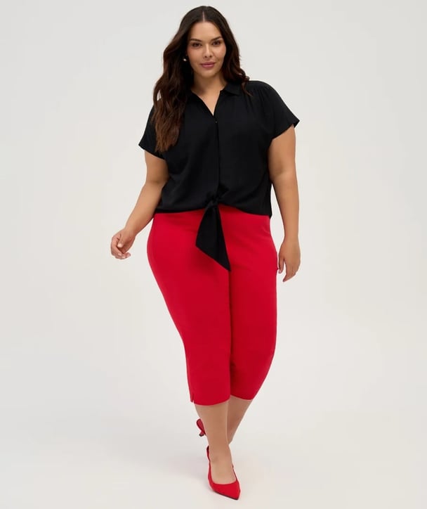 woman wearing red crop pants