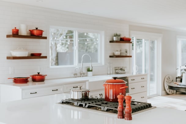 white kitchen with bad feng shui red crockery