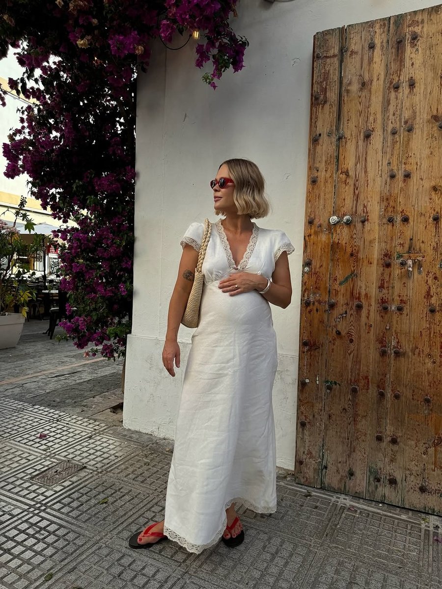 New Zealand influencer Jessie Bush in Ancient Greek Sandals jelly flats.