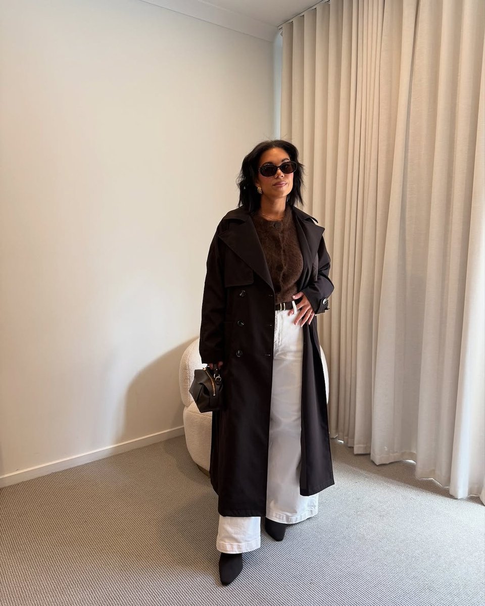 Stylist Emelia Morris wears ecru jeans with chocolate brown tones.