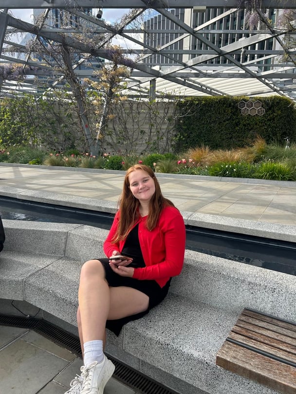 A girl poses with a smile.