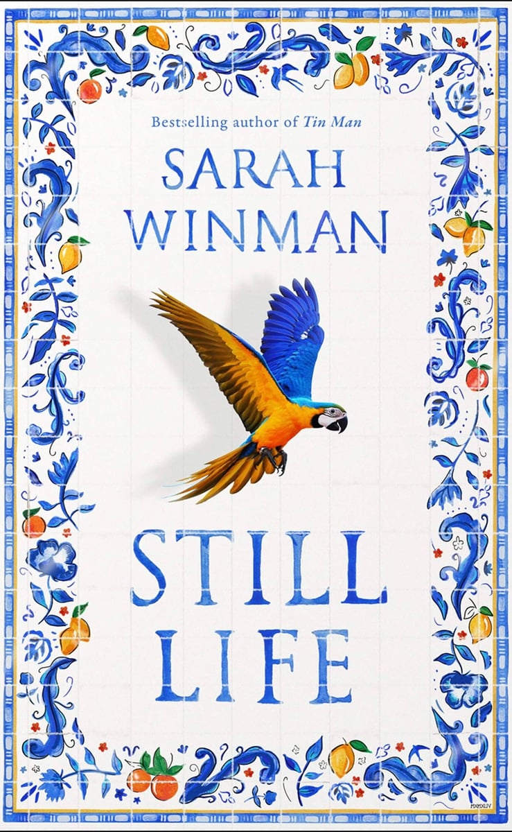 A white book cover with blue illustrated border and an bird in the centre. 