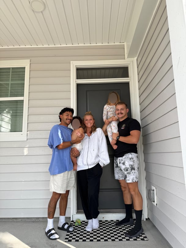 megan-michael-tyler-daughter-son-standing-outside-their-home