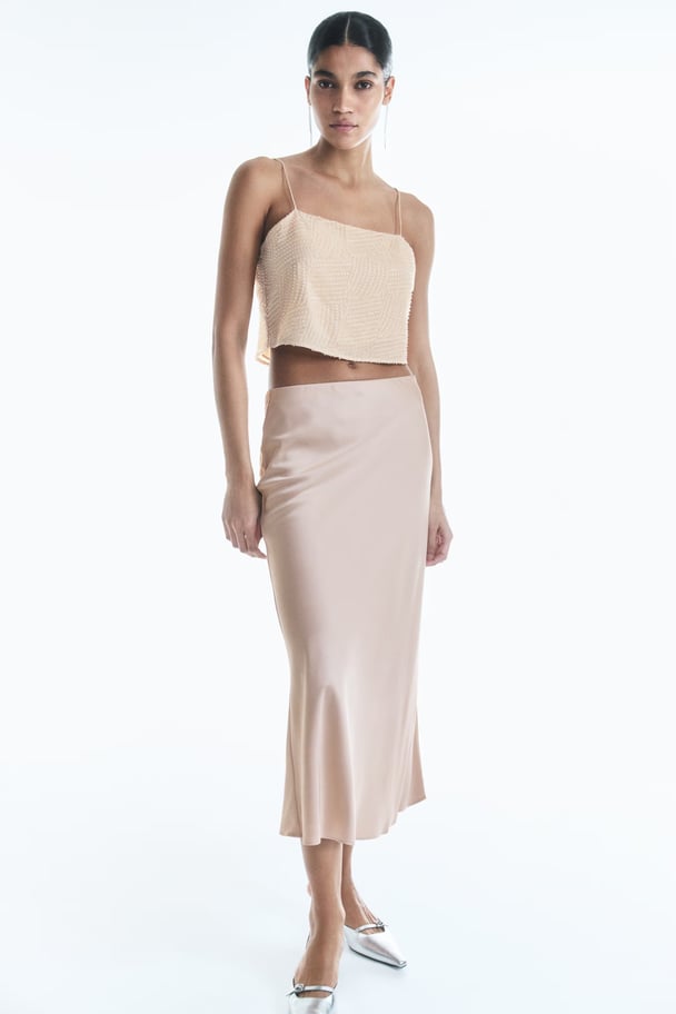 Unlined satin calf length skirt in cream
