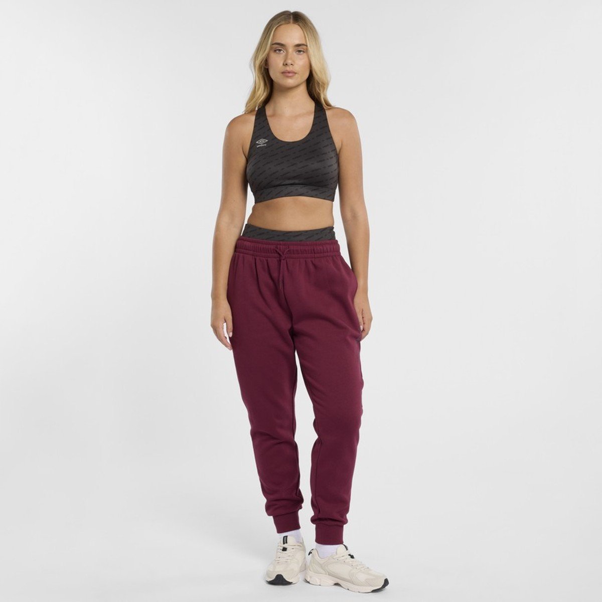 woman wearing track pants from Umbro
