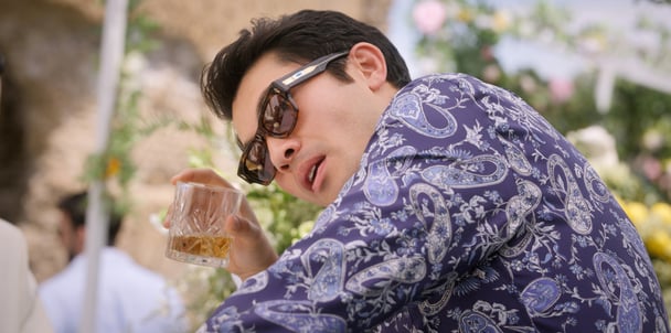 Henry Golding's Sean is a much darker man the second time around.