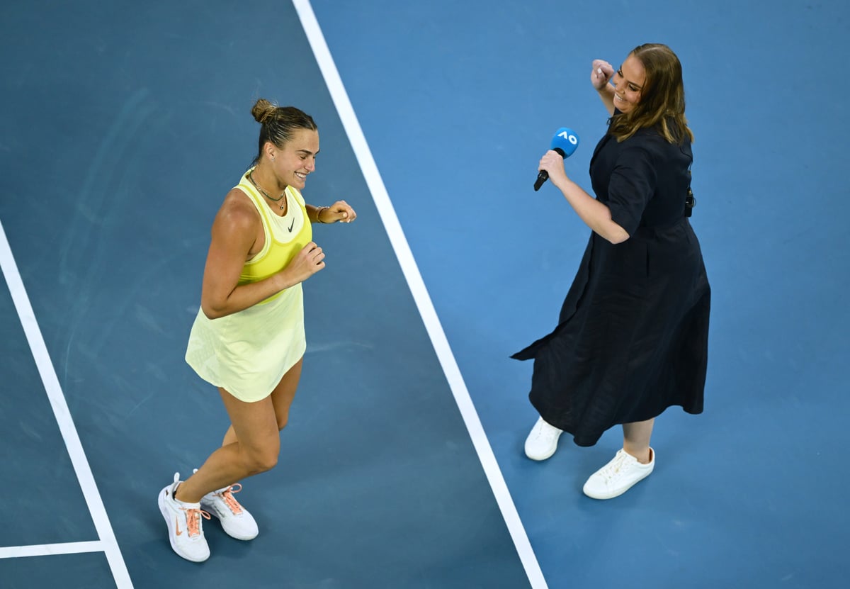 Aryna Sabalenka celebrates victory with on-court presenter Jelena Dokic following the Women's Singles First Round match against Sloane Stephens of the United States during day one of the 2025 Australian Open at Melbourne Park on January 12, 2025 in Melbourne, Australia.