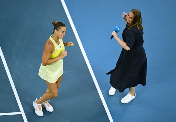 Aryna Sabalenka celebrates victory with on-court presenter Jelena Dokic following the Women's Singles First Round match against Sloane Stephens of the United States during day one of the 2025 Australian Open at Melbourne Park on January 12, 2025 in Melbourne, Australia.