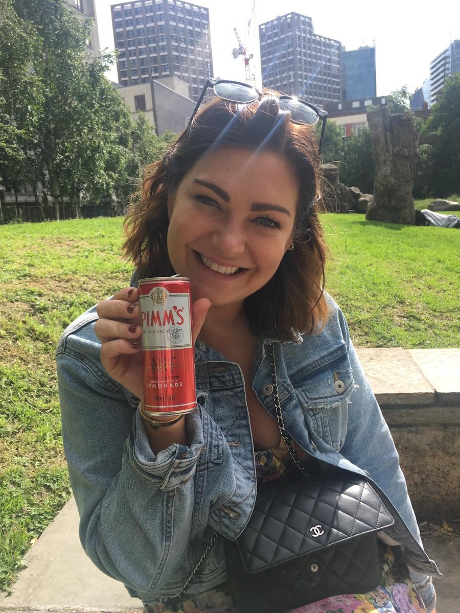 Woman drinking Pimm's in Londaon park.