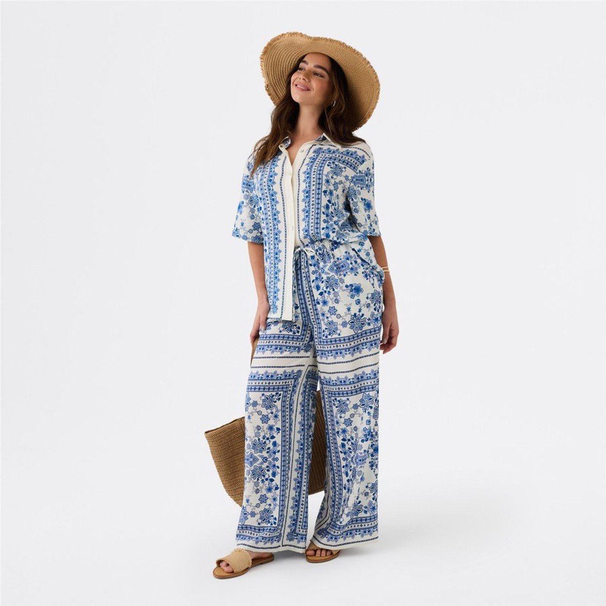 woman wearing blue and white set from Big W 