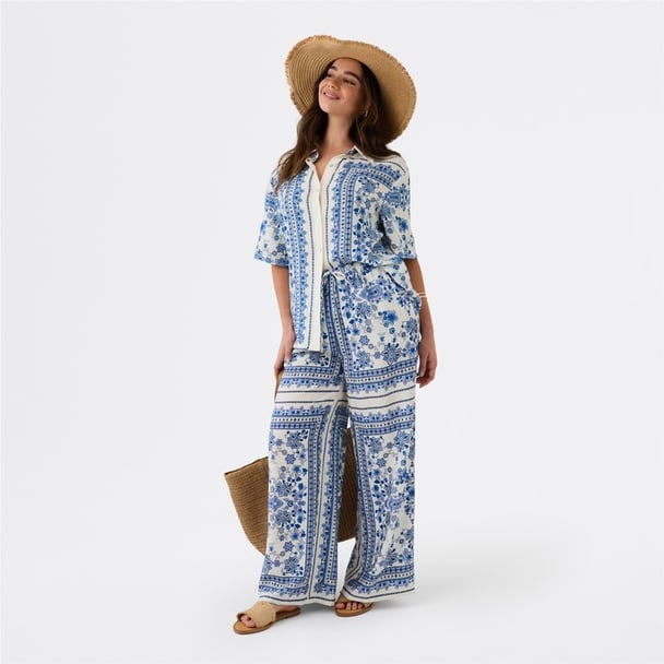 woman wearing blue and white set from Big W