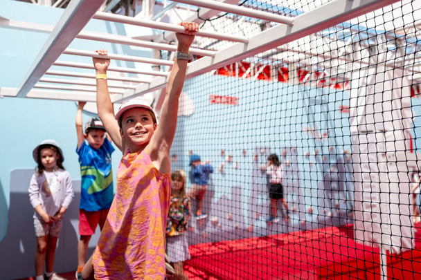 Kids climbing on an obstacle course inside the AO Ballpark, Melbourne.