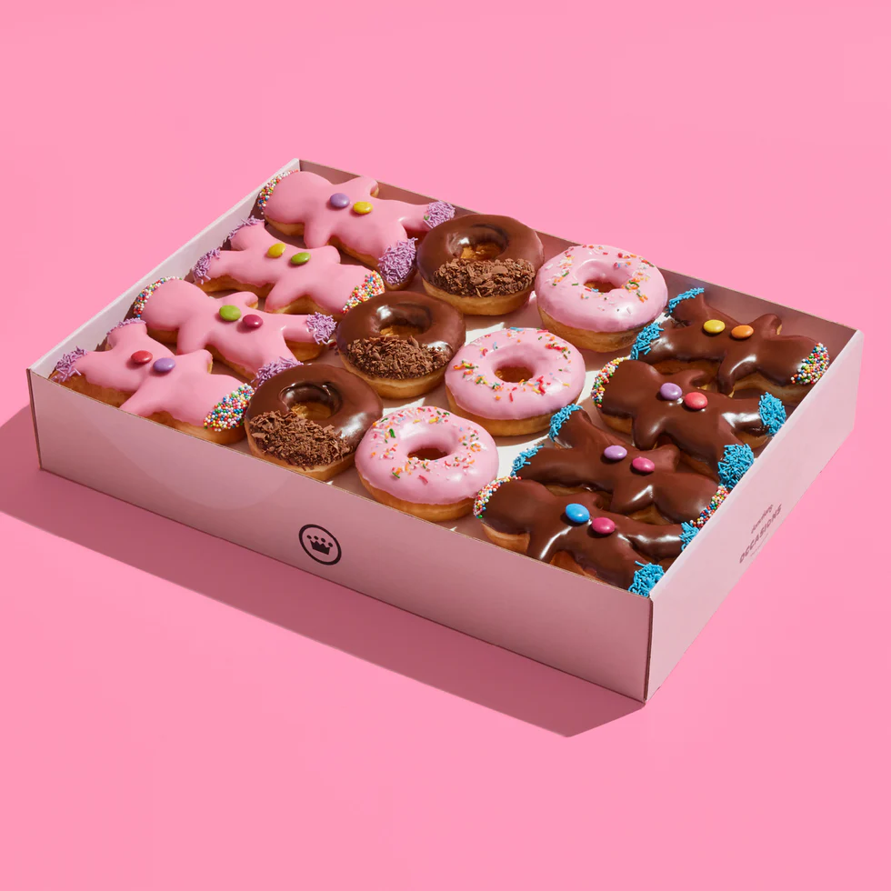 strawberry and chocolate donuts in a box 