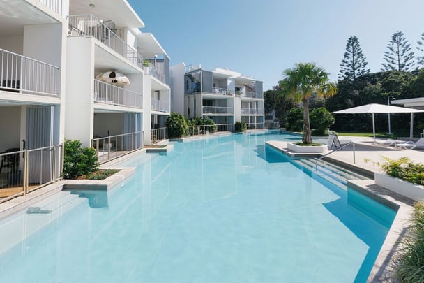 A holiday unit complex with balconies overlooking the pool at Acacia Drift.