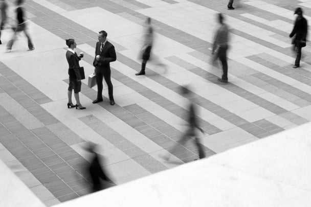Male and female colleague talking.