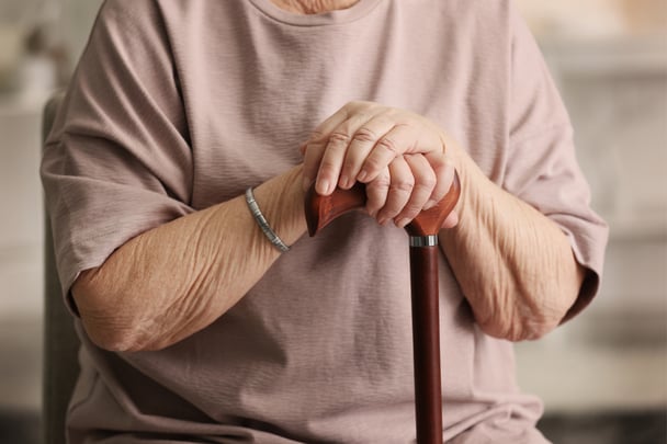 Elderly woman walking stick.