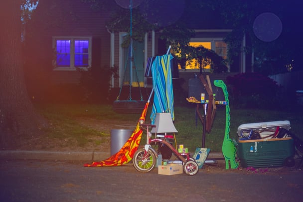 Sue Barr's personal effects line the curb as her home prepares for sale.