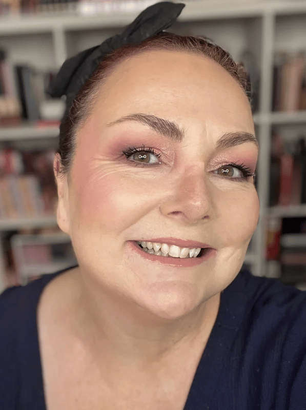 Beauty writer Teresa McNamara smiling and wearing makeup.