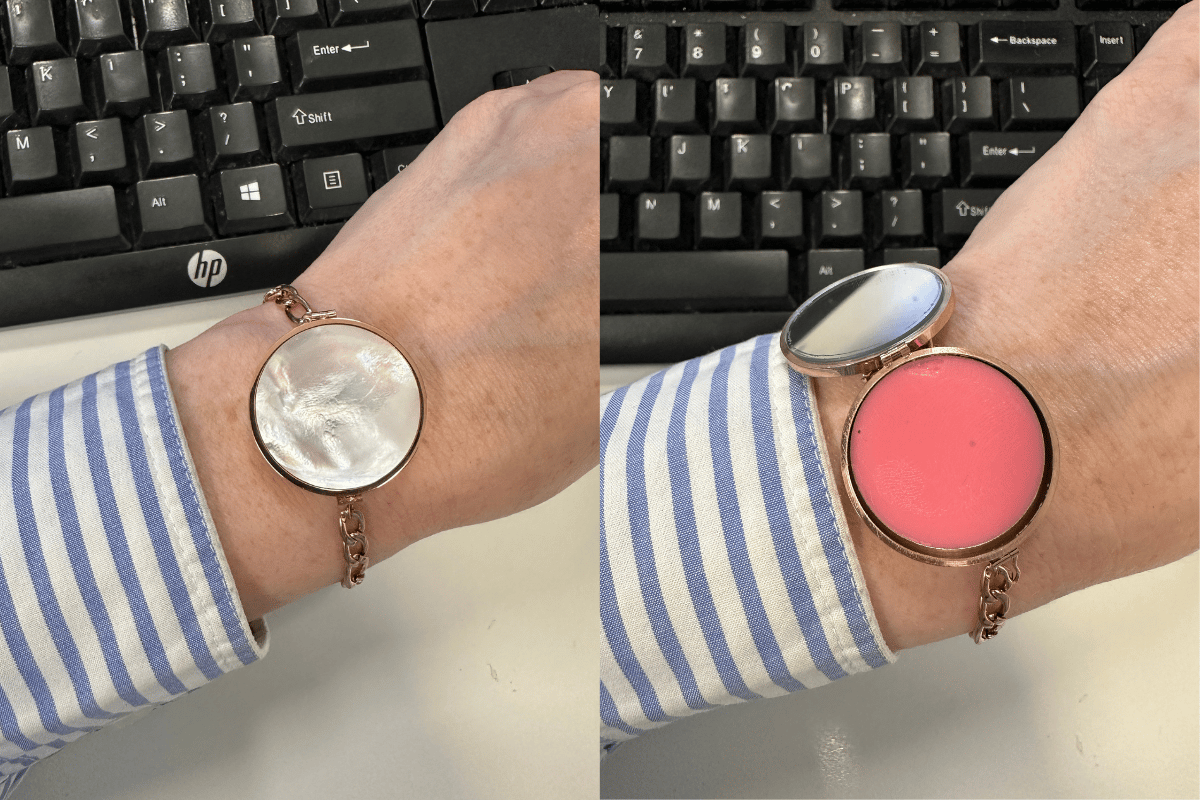 Get Balmy Original Lip Balm Bracelet in 14K Gold on someone's wrist, pictured in front of a keyboard.