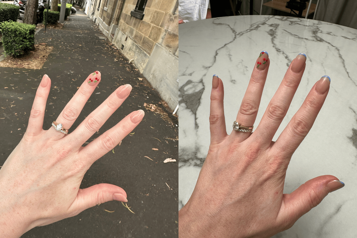 A split photo of a manicure with cherries and a blue french tip.