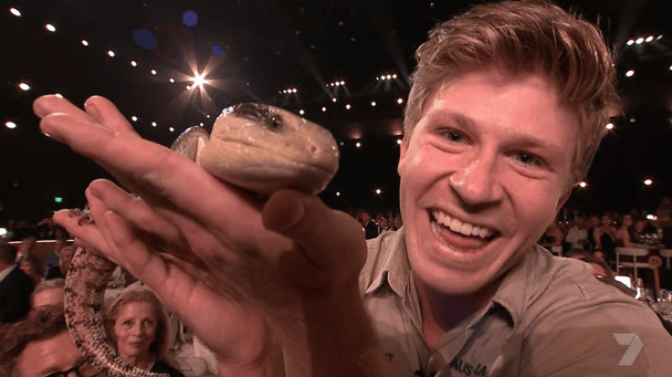 Robert Irwin holding a lizard at his first Logies hosting gig.