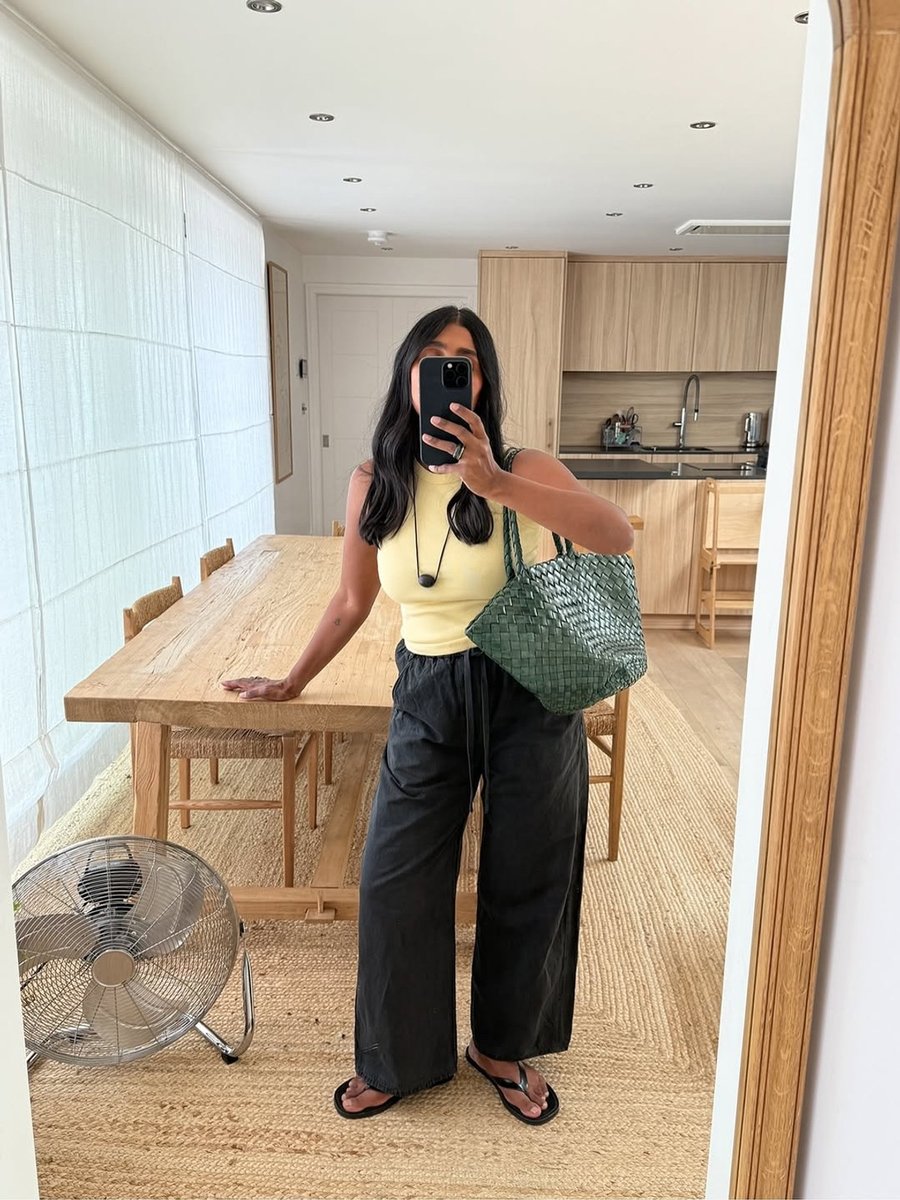 Influencer Monikh wears Flore Flore tank in yellow.