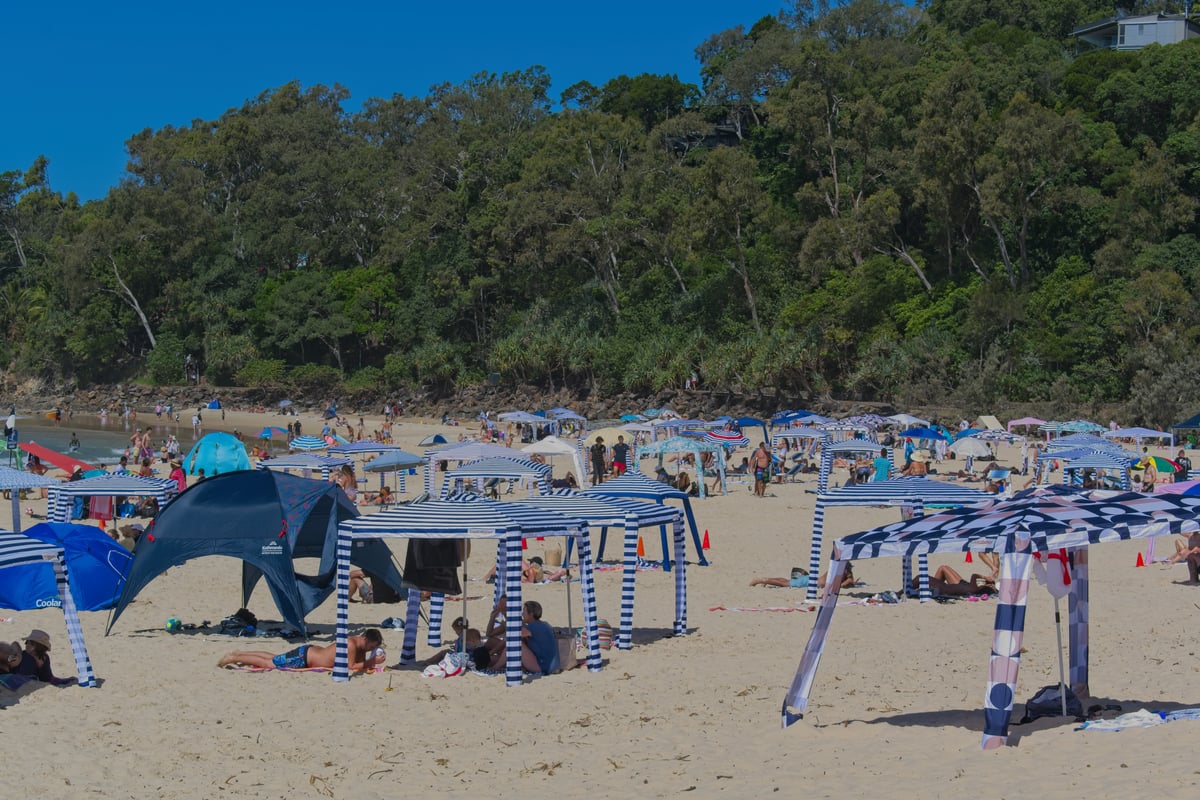 A beach with too many beach cabanas.