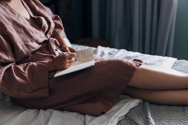 Woman writing letter.