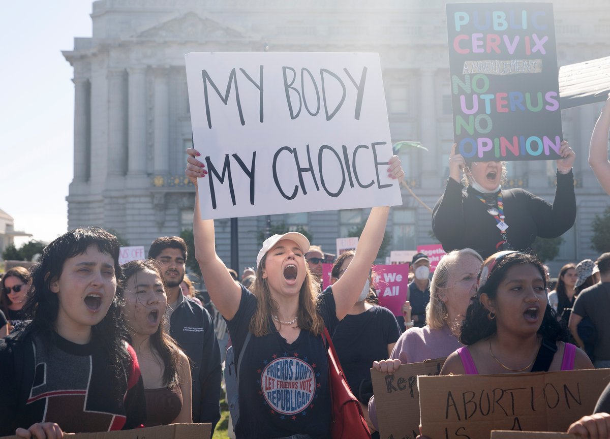 Demonstrators protest against Roe v Wade being overturned.