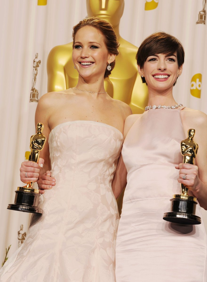 Jennifer Lawrence and Anne Hathaway at the 2013 Oscars.