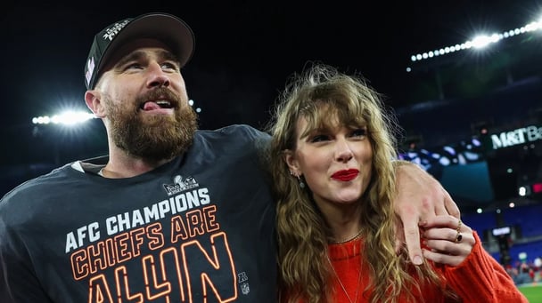 American professional football Kansas City Chiefs player Travis Kelce stands with his hand around the shoulder of partner Taylor Swift.