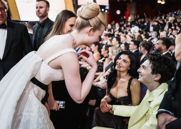 Elle Fanning greets Kylie Jenner and Timothee Chalamet at the Oscars.