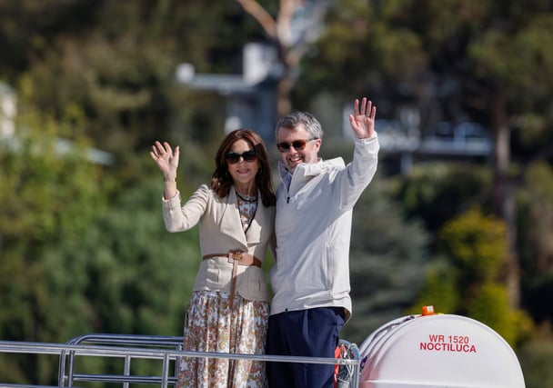 Queen Mary and King Frederik of Denmark waving to crowds in Hobart during their 2026 Australian tour.