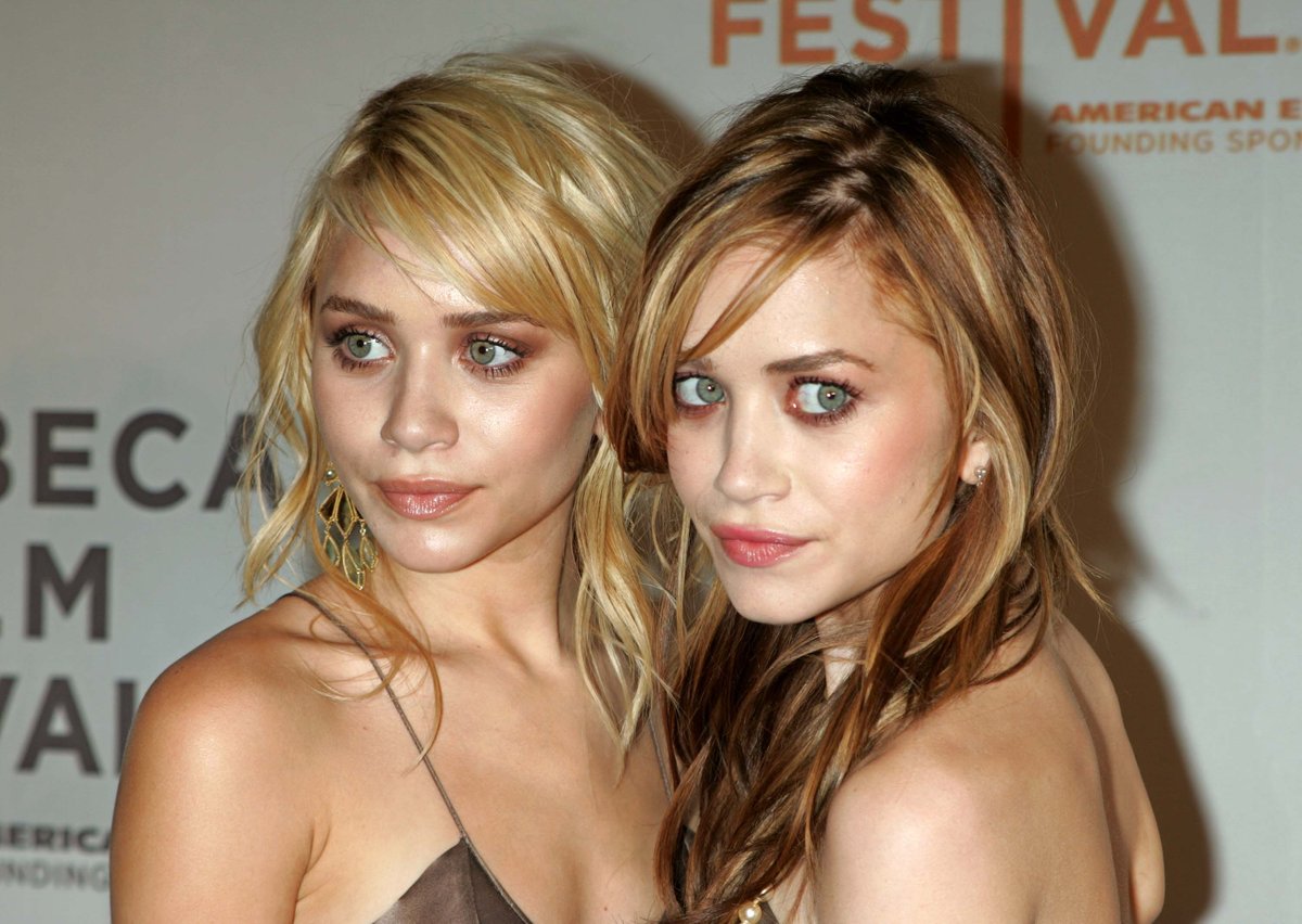 A close-up photo of Ashley and Mary Kate Olsen at the Tribeca Film Festival in 2004.