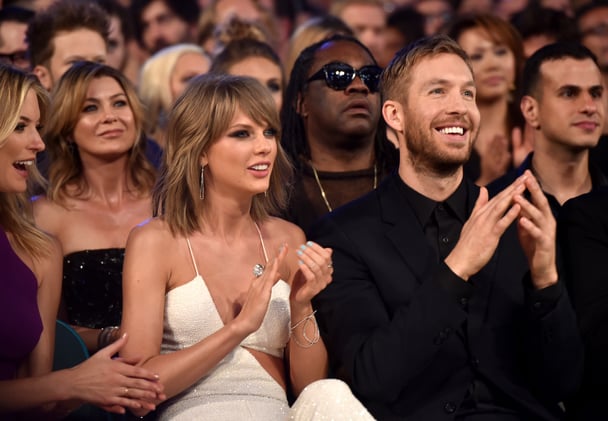 Taylor Swift and Calvin Harris sitting together at the MTV VMAs in 2015.