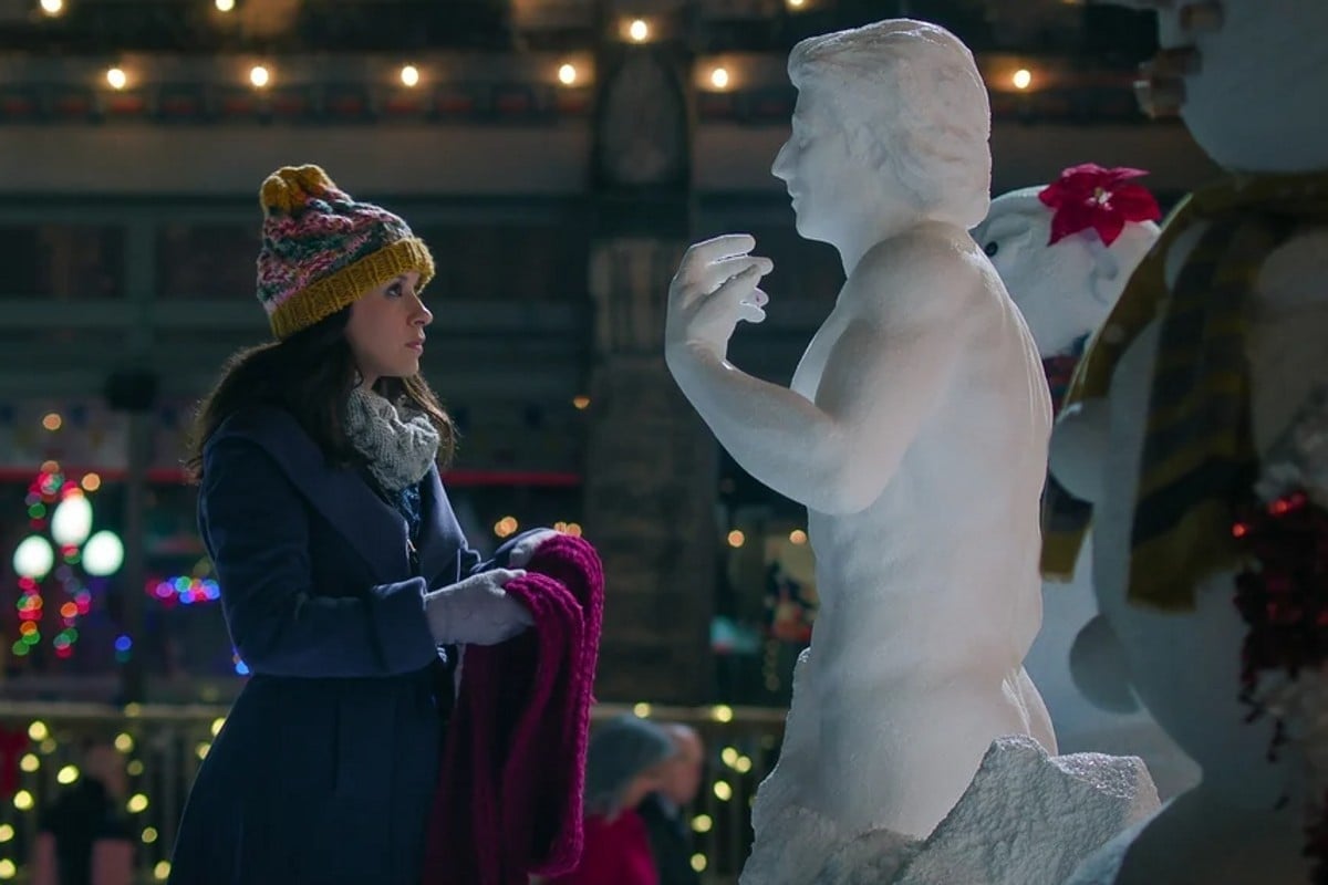 Lacey Chabert and a snowman version of Dustin Milligan in the Netflix Christmas movie Hot Frosty.