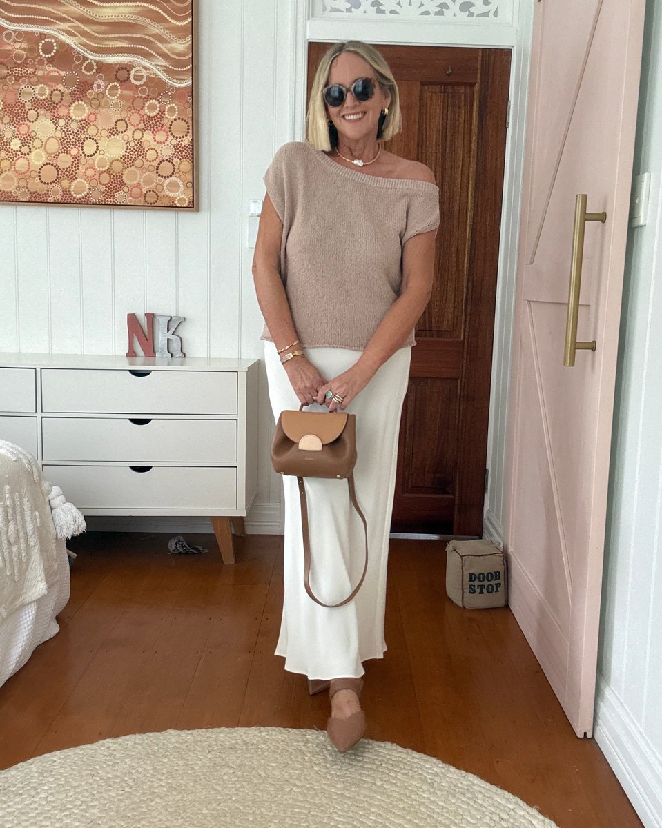 Content Creator and writer Nikki Parkinson wears knit top and long skirt