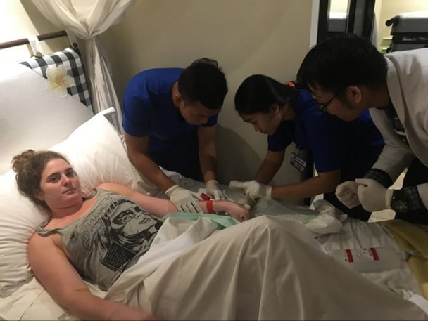 Young Australian woman getting treated for methanol poisoning in Bali.