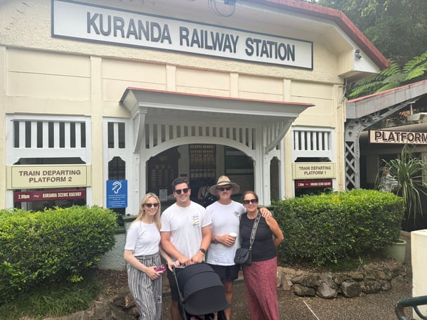 Leonie and her family in front of the Kuranda station.