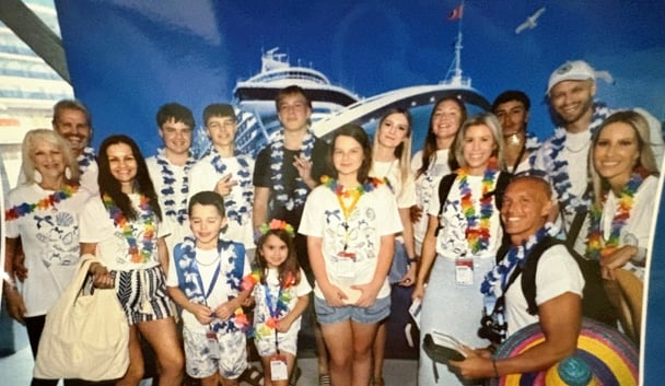 Nicole's extended family stand for a photo on the cruise ship.