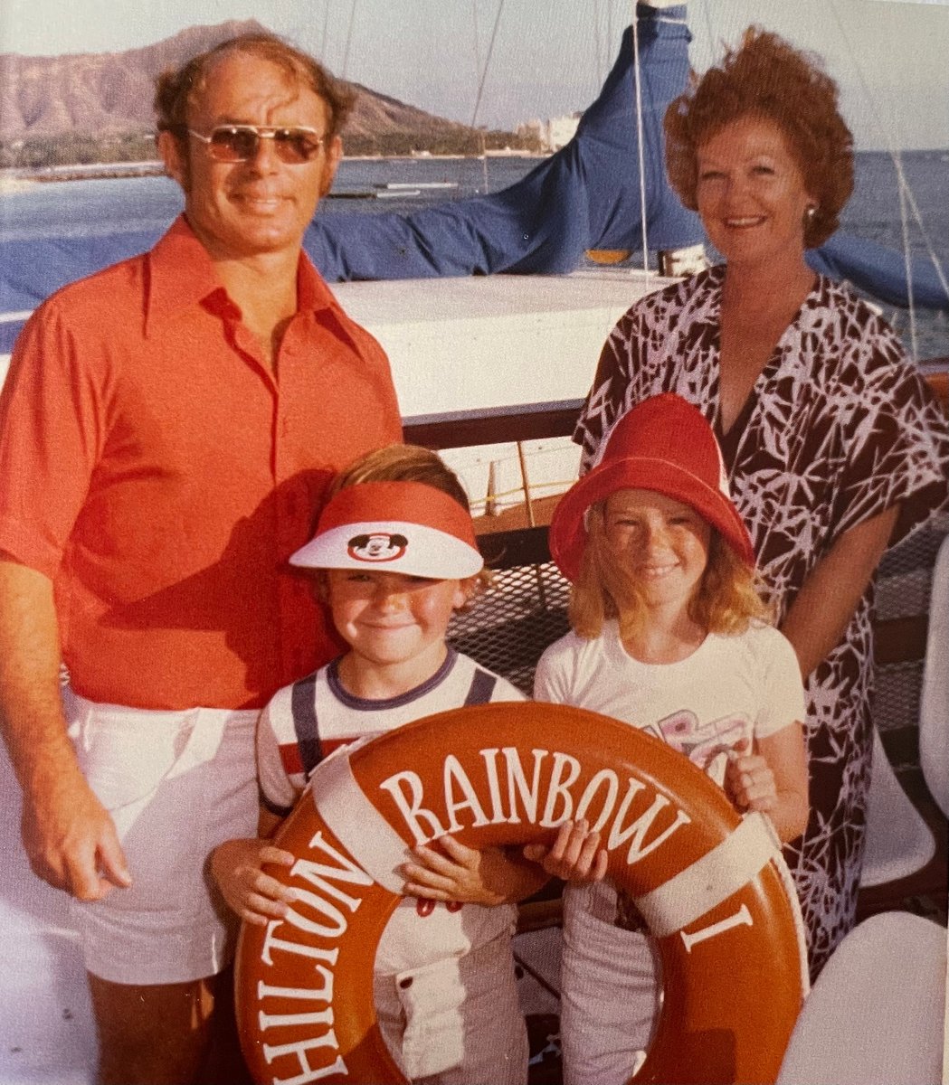 Childhood photo of Sarah Jones on a boat with her mother, father and brother.