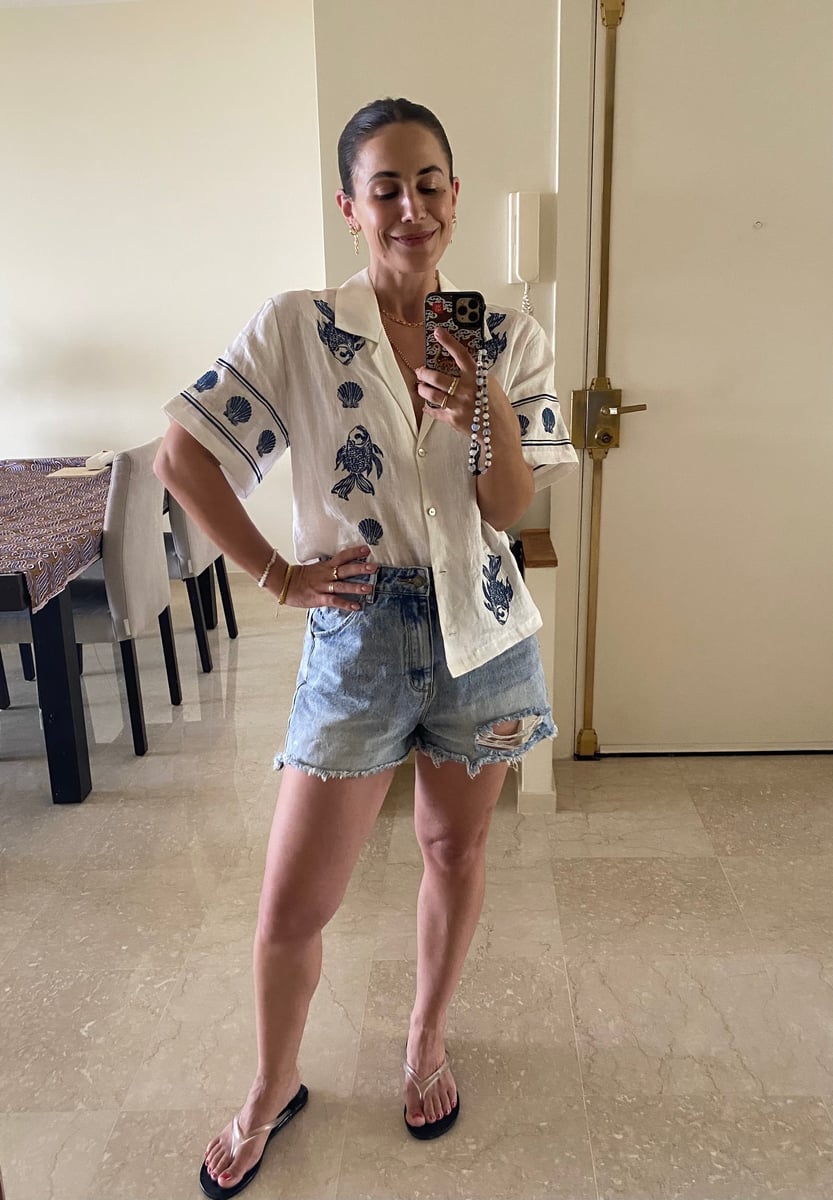 Writer wears clear flip flops with denim shorts.