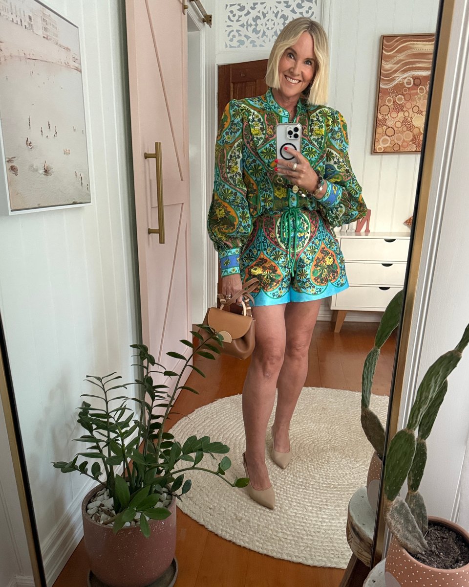 Content Creator and writer Nikki Parkinson wears colourful playsuit 