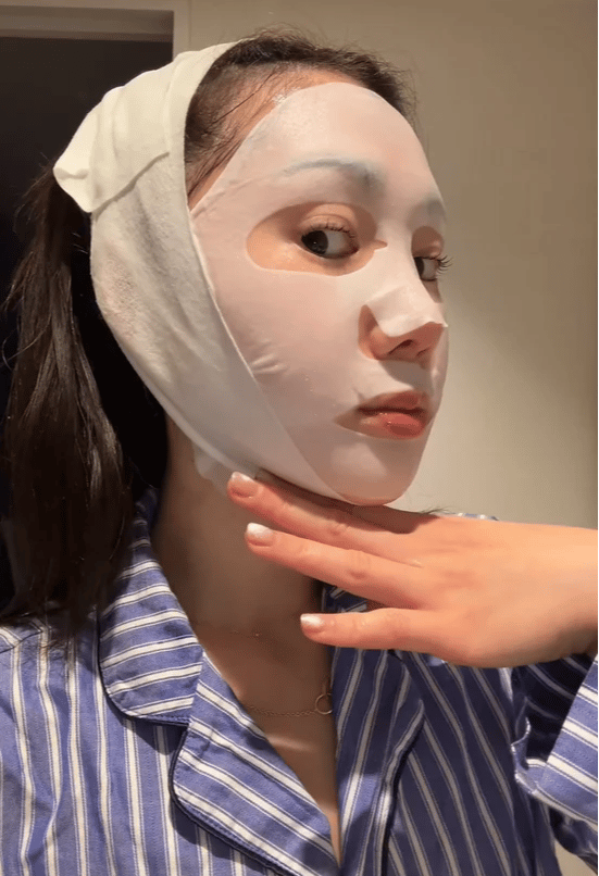 Author wears a korean contouring mask.